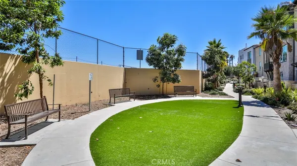 a front view of a residential apartment building with a yard