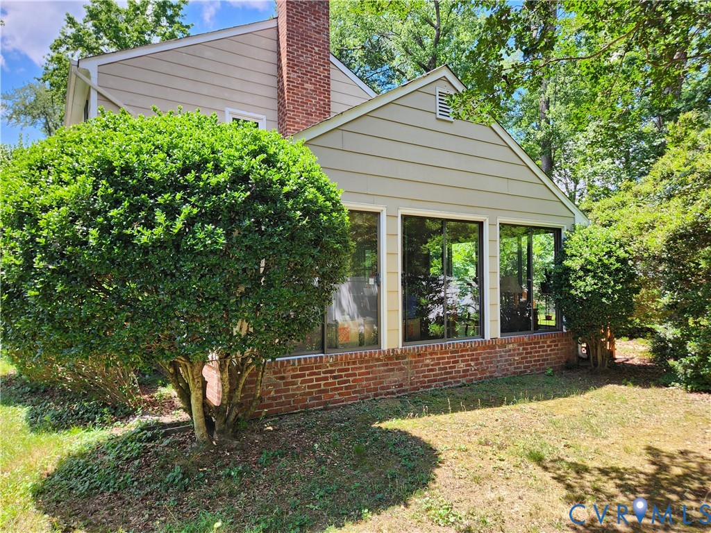 10260 Maplested Lane Henrico, VA 23229 - Photo 36 of 38 Exterior siding with a prominent brick chimney and