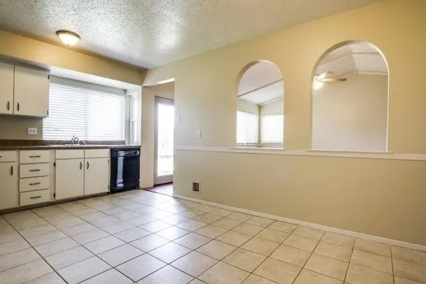 a view of a kitchen with marble countertop cabinets and a sink
