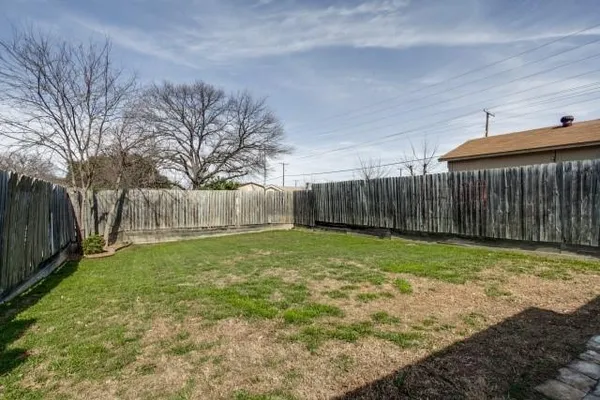 a backyard of a house with lots of green space