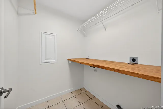 a view of a room with racks on the wall