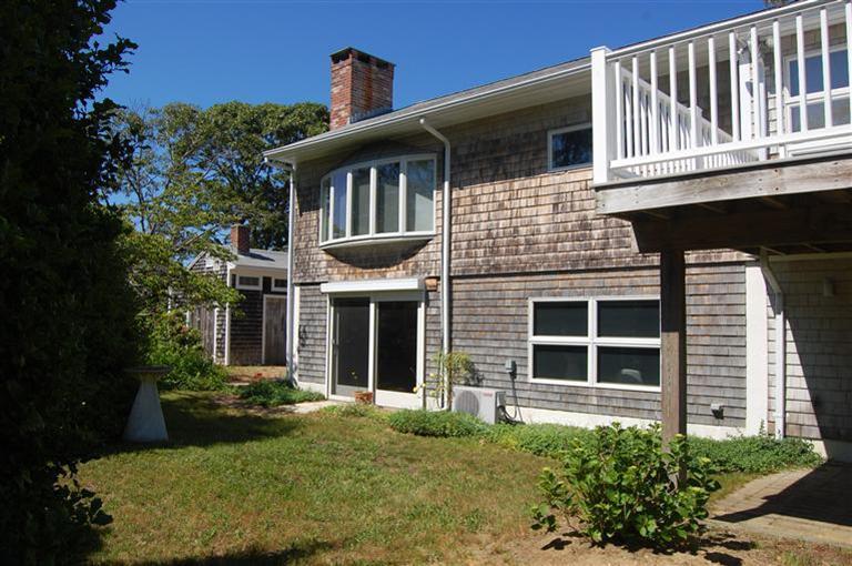 10 Nickerson Road Eastham, MA 02642 - Photo 5 of 24 a front view of a house with a yard