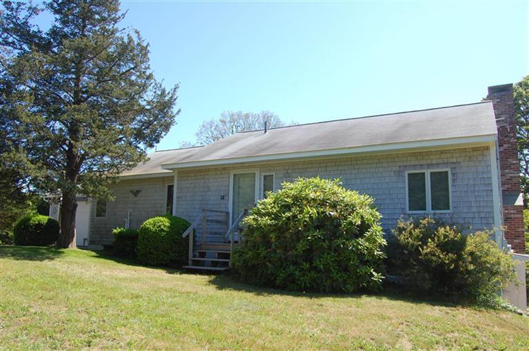 10 Nickerson Road Eastham, MA 02642 - Photo 7 of 24 a front view of a house with garden