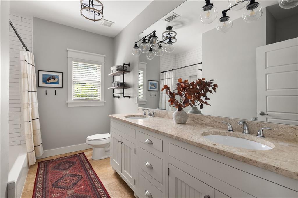 266 Atlanta Avenue Southeast Atlanta, GA 30315 - Photo 44 of 70 a bathroom with a granite countertop sink mirror vanity and toilet