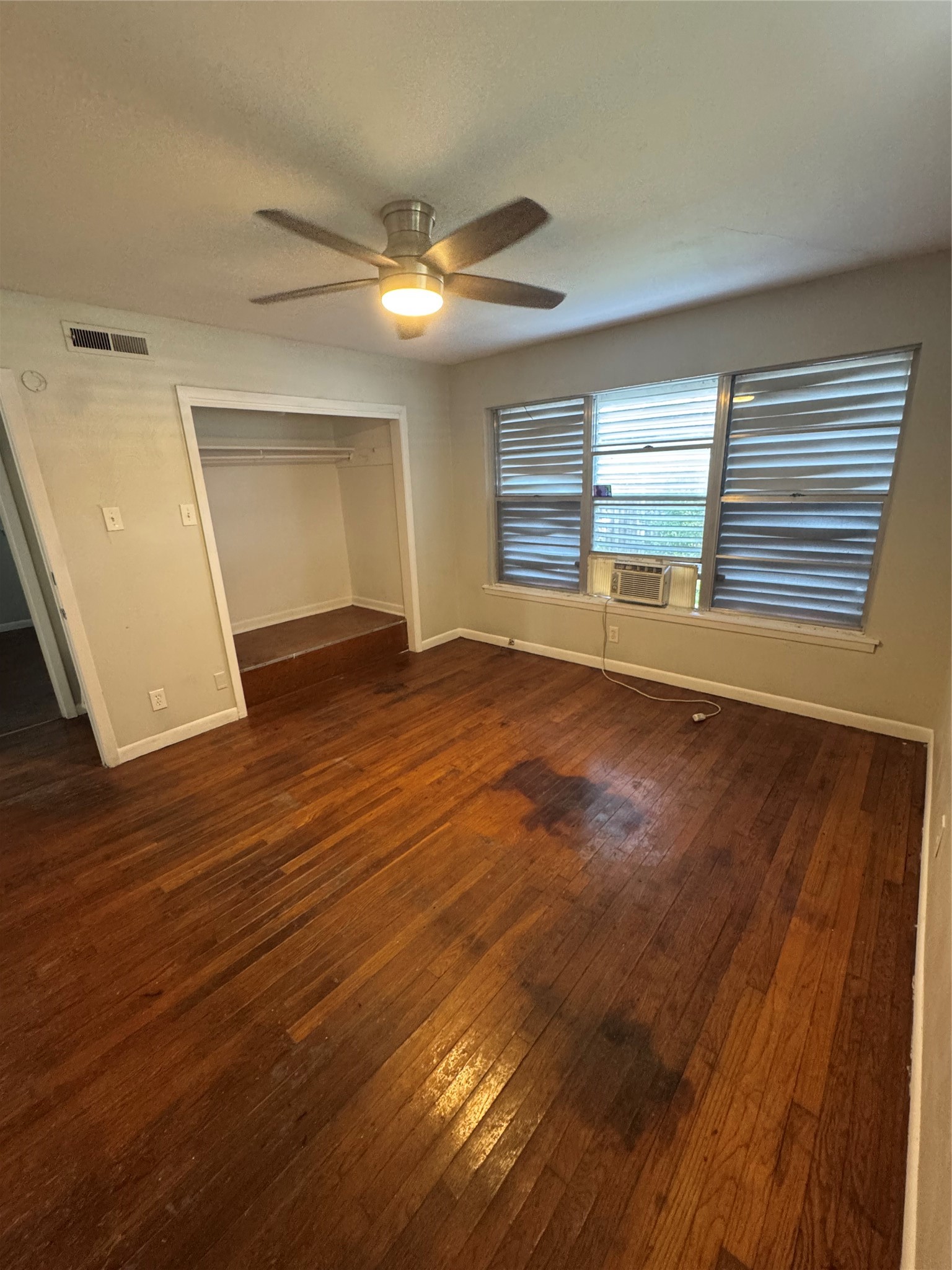 2522 Jackson La Marque, TX 77568 - Photo 6 of 18 an empty room with wooden floor and windows