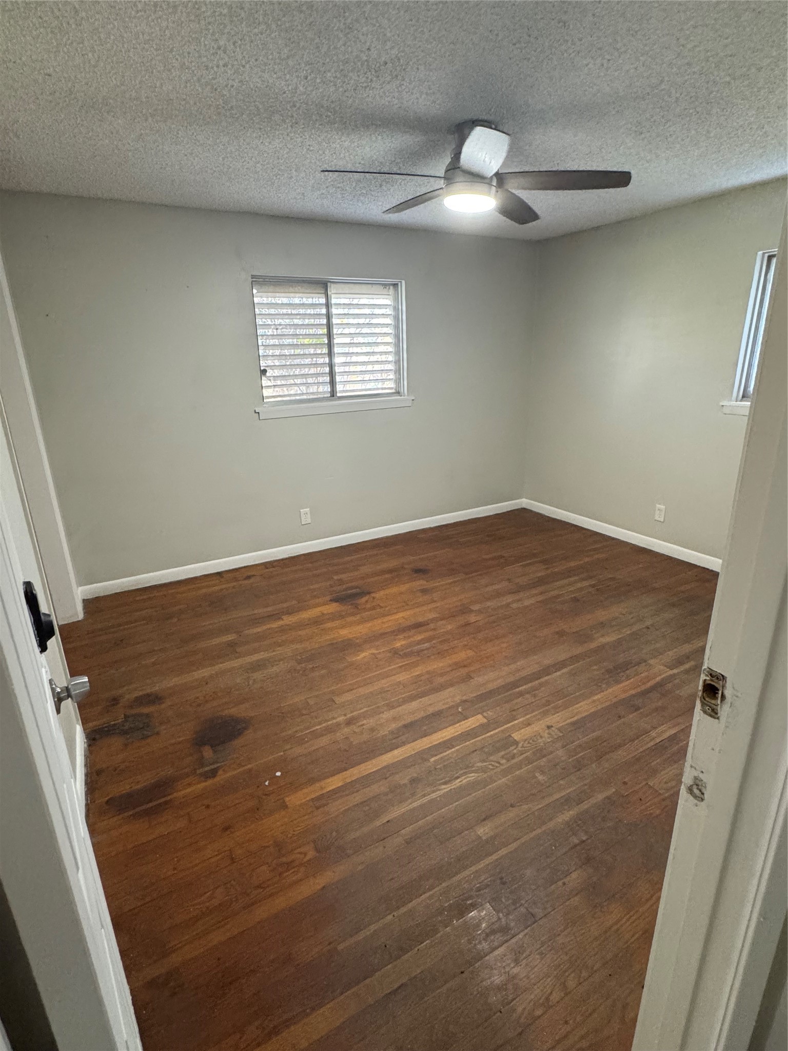 2522 Jackson La Marque, TX 77568 - Photo 7 of 18 wooden floor in an empty room with a window