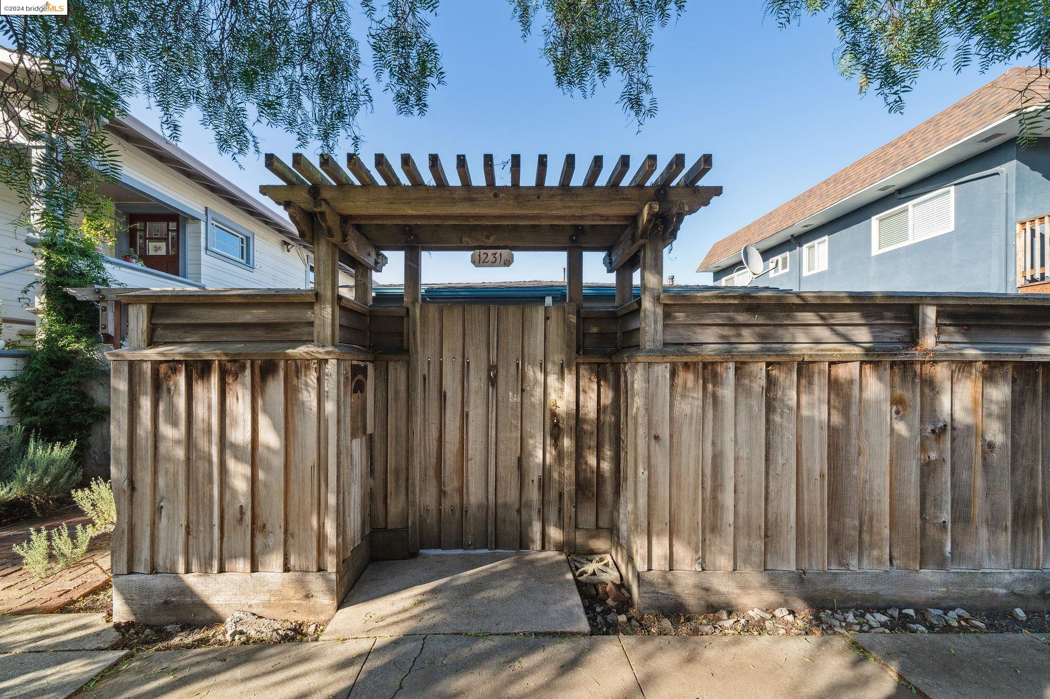 1231 Channing Way Berkeley, CA 94702 - Photo 1 of 1 a view of a porch with a wooden fence