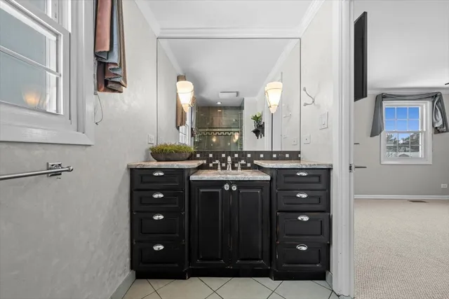 a bathroom with a vanity and a mirror