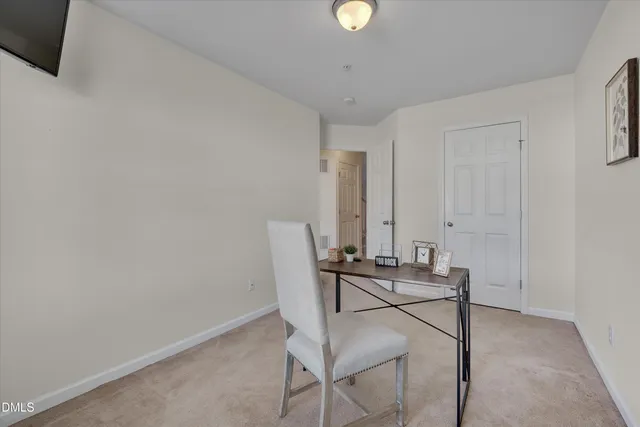 a view of a workspace with furniture