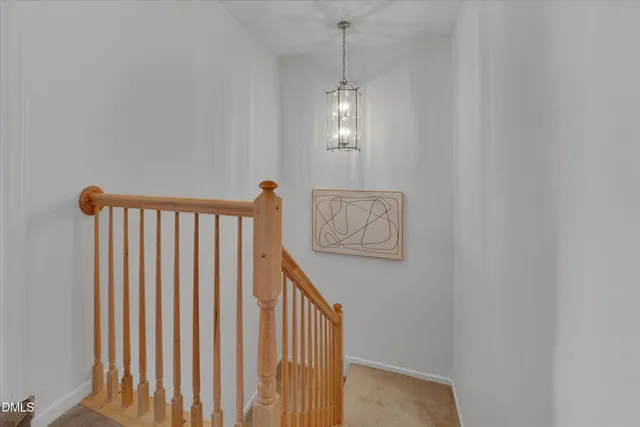 a view of a hallway with stairs