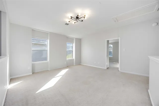 a bathroom with a granite countertop sink a toilet and a mirror