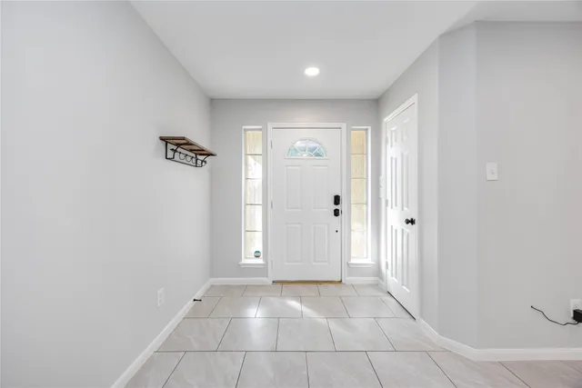 an empty room with windows and yard