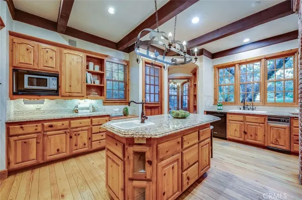 a room with pool table and windows