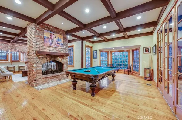 a living room with furniture a fireplace and a table