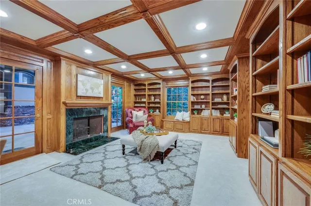 a bathroom with a granite countertop sink mirror vanity and toilet