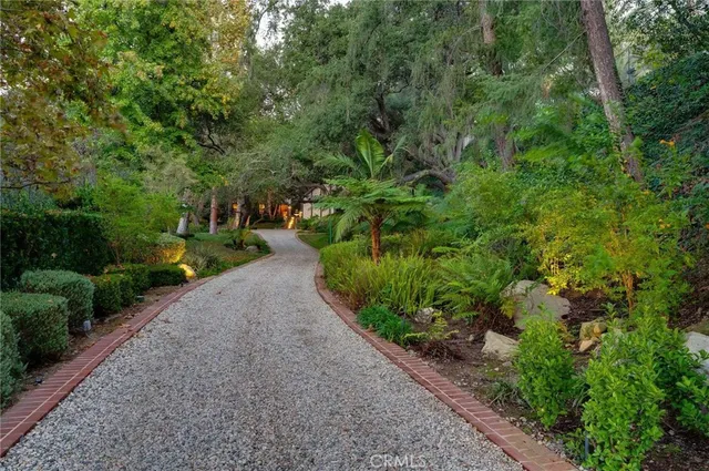 a view of a house with a fountain in a patio