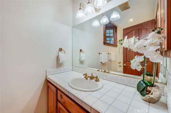 a living room with furniture and floor to ceiling windows