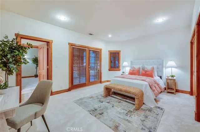 a spacious bathroom with a granite countertop sink mirror and shower
