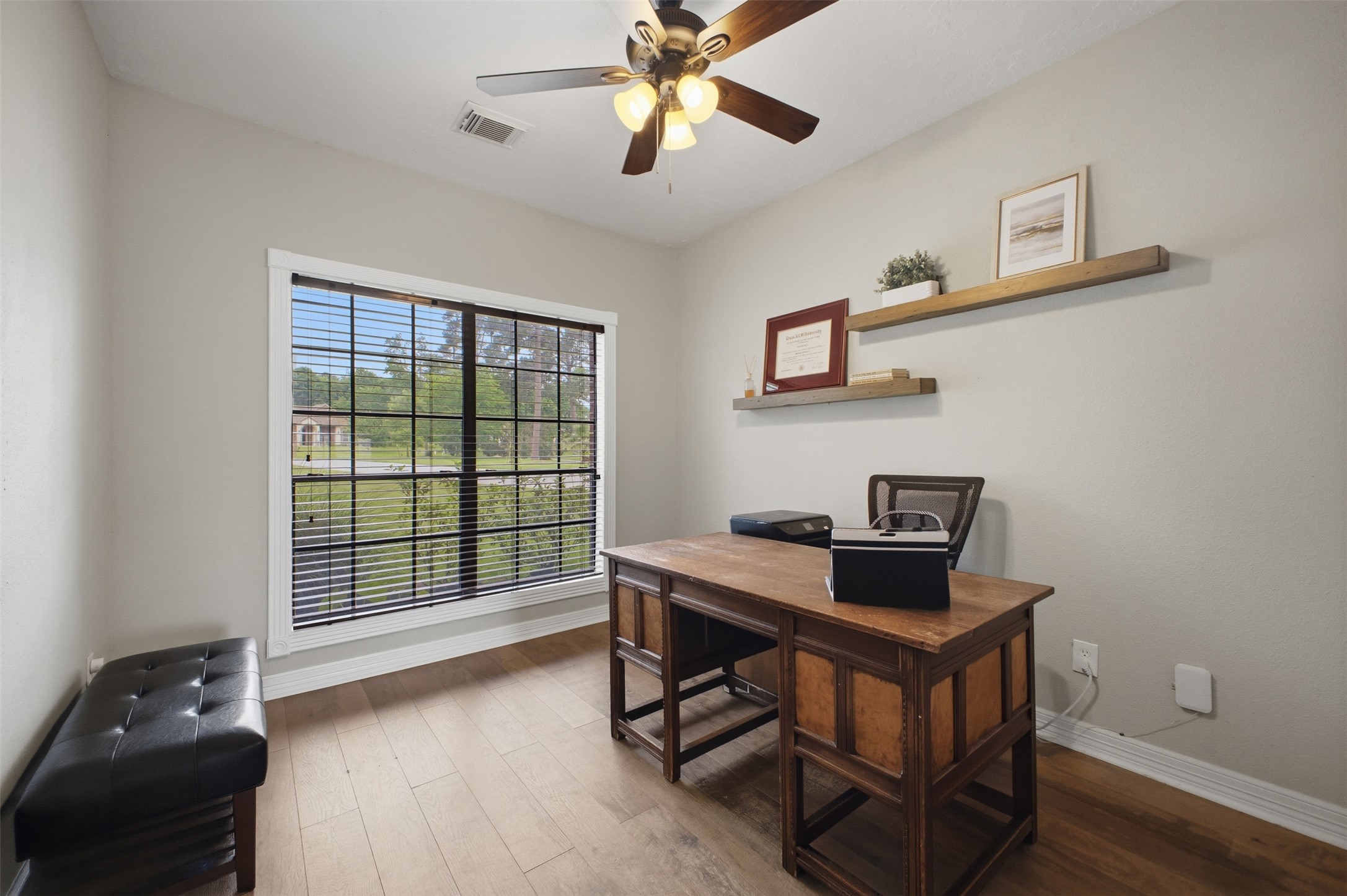 12710 Aries Loop Willis, TX 77318 - Photo 4 of 40 This room features light-colored walls and wood flooring