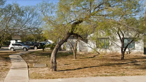a view of yard along with trees