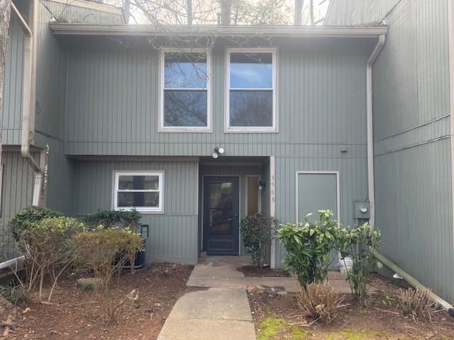 3563 Splinterwood Road Peachtree Corners, GA 30092 - Photo 1 of 13 a front view of a house with yard
