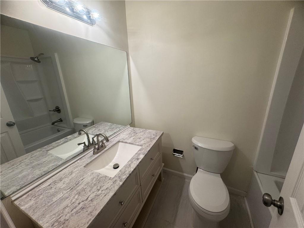 3563 Splinterwood Road Peachtree Corners, GA 30092 - Photo 8 of 13 a bathroom with a sink toilet and shower