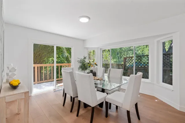 a view of a dining room with furniture and window