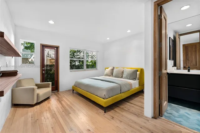 a bedroom with a bed and a couch