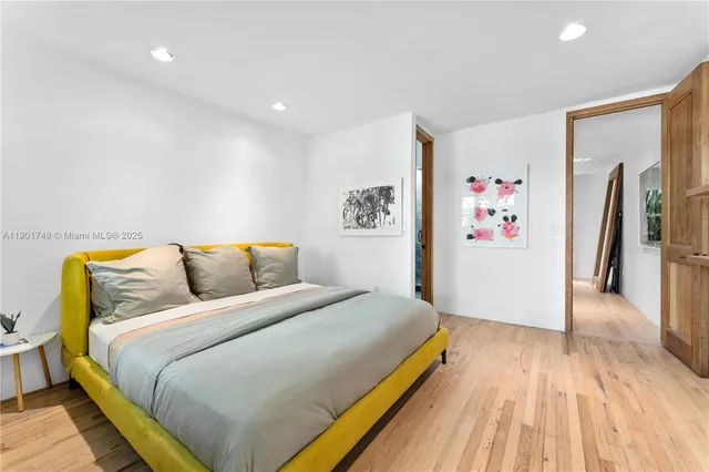 a bedroom with a bed and a couch