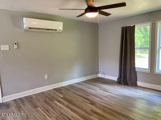 178180 Hillside Road Oak Ridge, TN 37830 - Photo 3 of 25 an empty room with wooden floor fan and windows