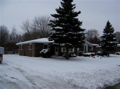 5409-11 Aspen Road Portage, IN 46368 - Photo 1 of 1 a view of a house with a yard covered in snow