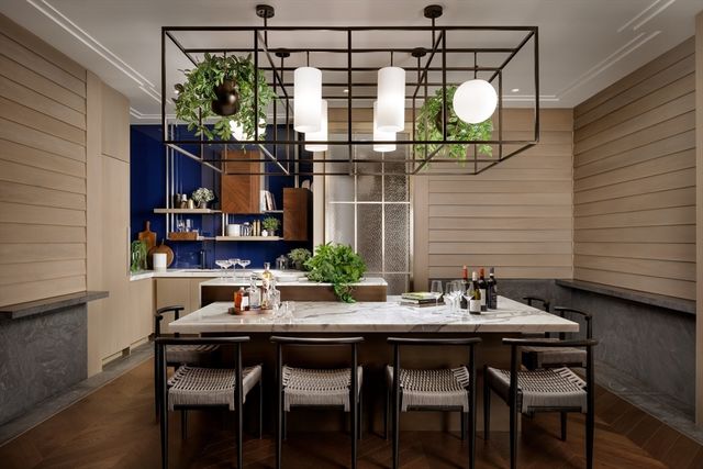 a view of a dining room with furniture and chandelier