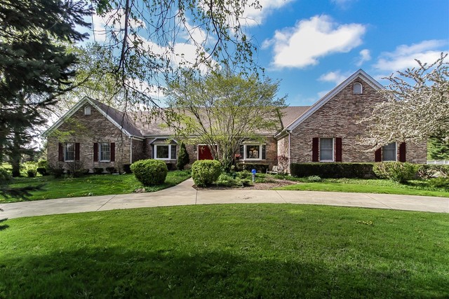 5N884 Dunham Trails Road Wayne, IL 60184 - Photo 1 of 26 a front view of a house with a yard and trees