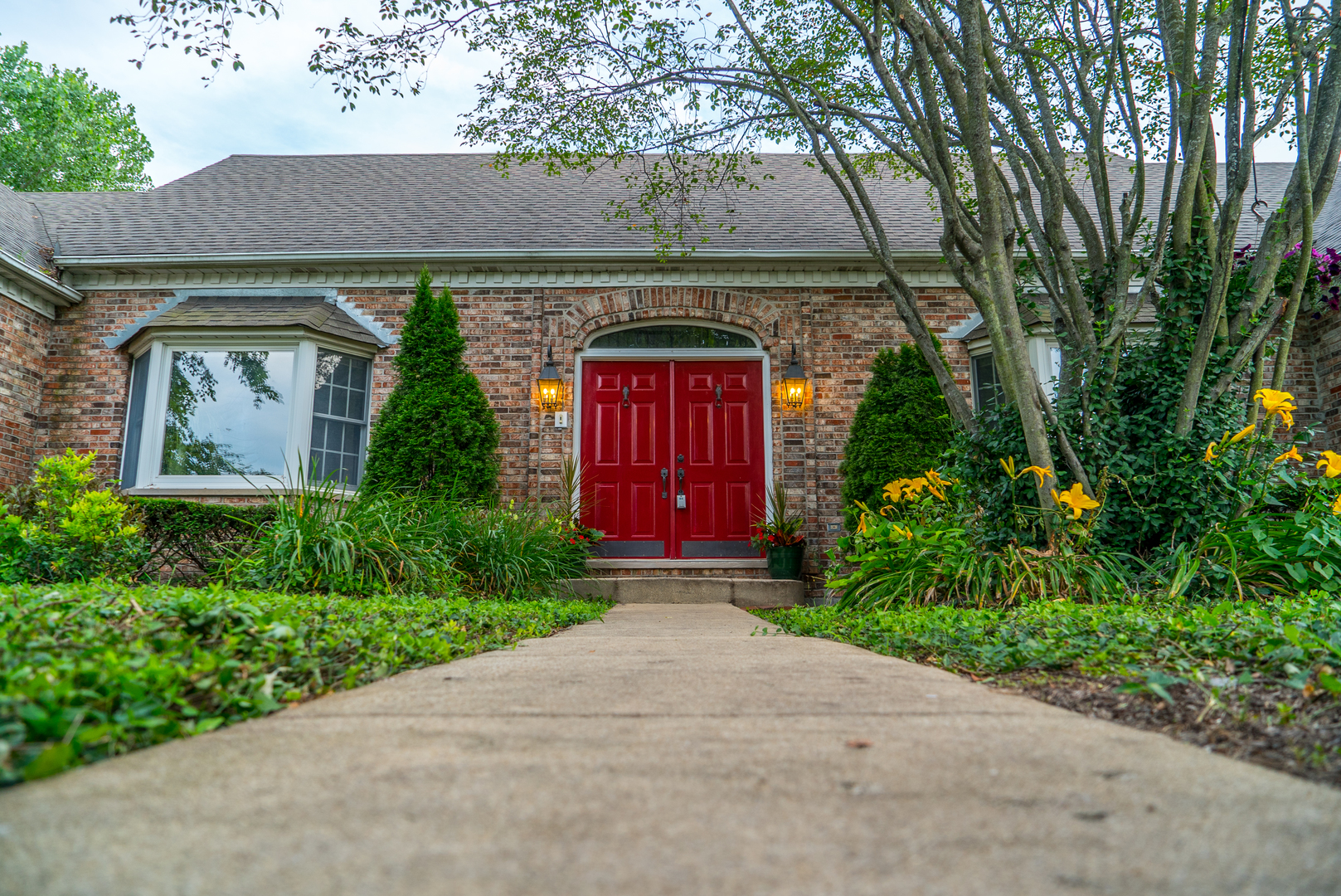 5N884 Dunham Trails Road Wayne, IL 60184 - Photo 2 of 26 a front view of a house with garden