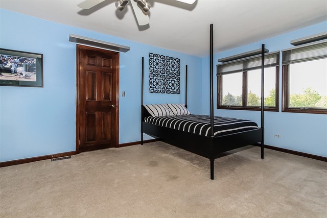 5N884 Dunham Trails Road Wayne, IL 60184 - Photo 13 of 26 a bedroom with furniture and window