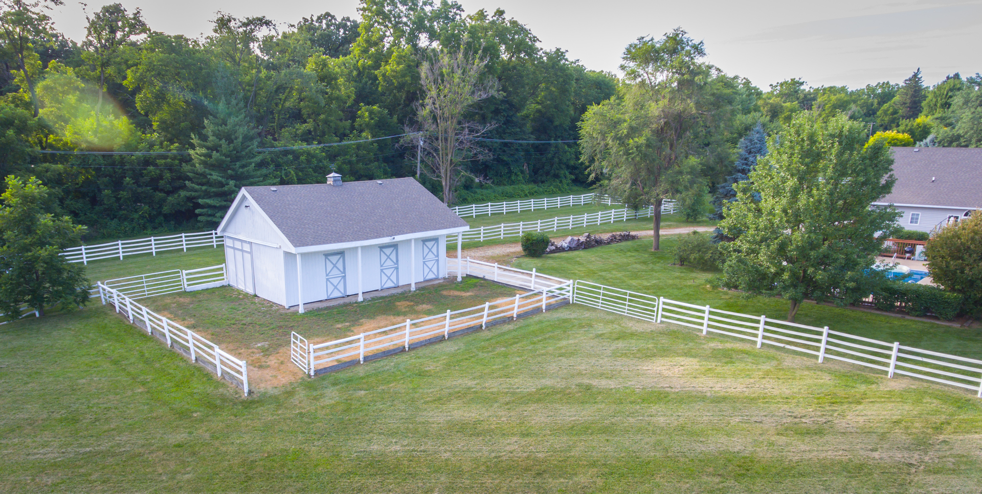5N884 Dunham Trails Road Wayne, IL 60184 - Photo 20 of 26 a view of a house with pool and a yard