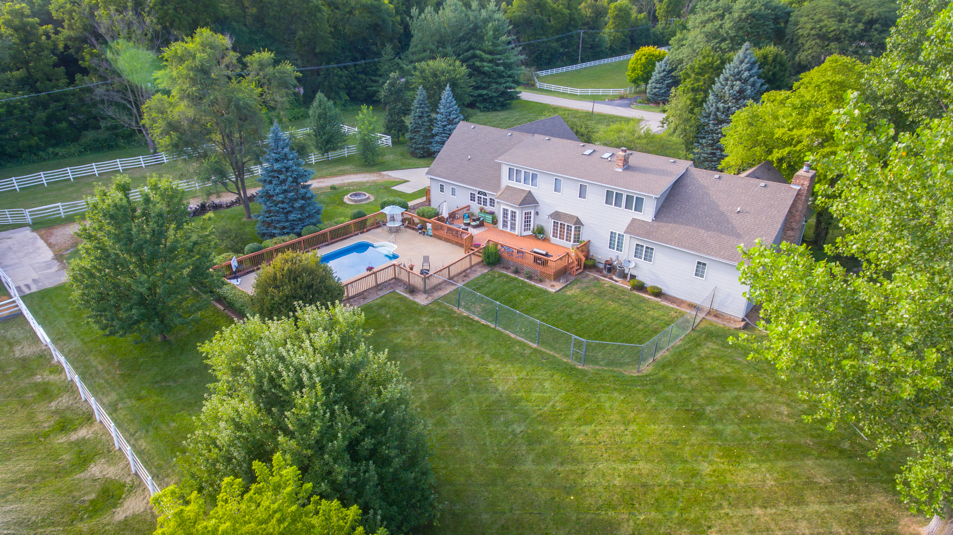 5N884 Dunham Trails Road Wayne, IL 60184 - Photo 25 of 26 an aerial view of a house with garden space and street view