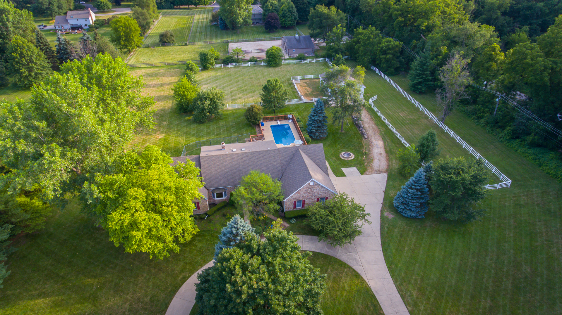 5N884 Dunham Trails Road Wayne, IL 60184 - Photo 26 of 26 an aerial view of a house with a yard swimming pool and outdoor seating