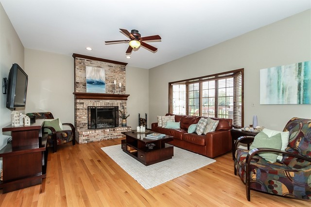 5N884 Dunham Trails Road Wayne, IL 60184 - Photo 9 of 26 a living room with furniture fireplace and flat screen tv