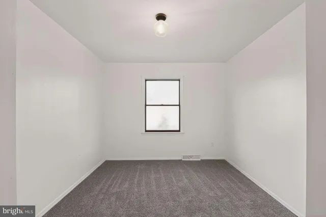 a bathroom with a toilet sink vanity tub and shower