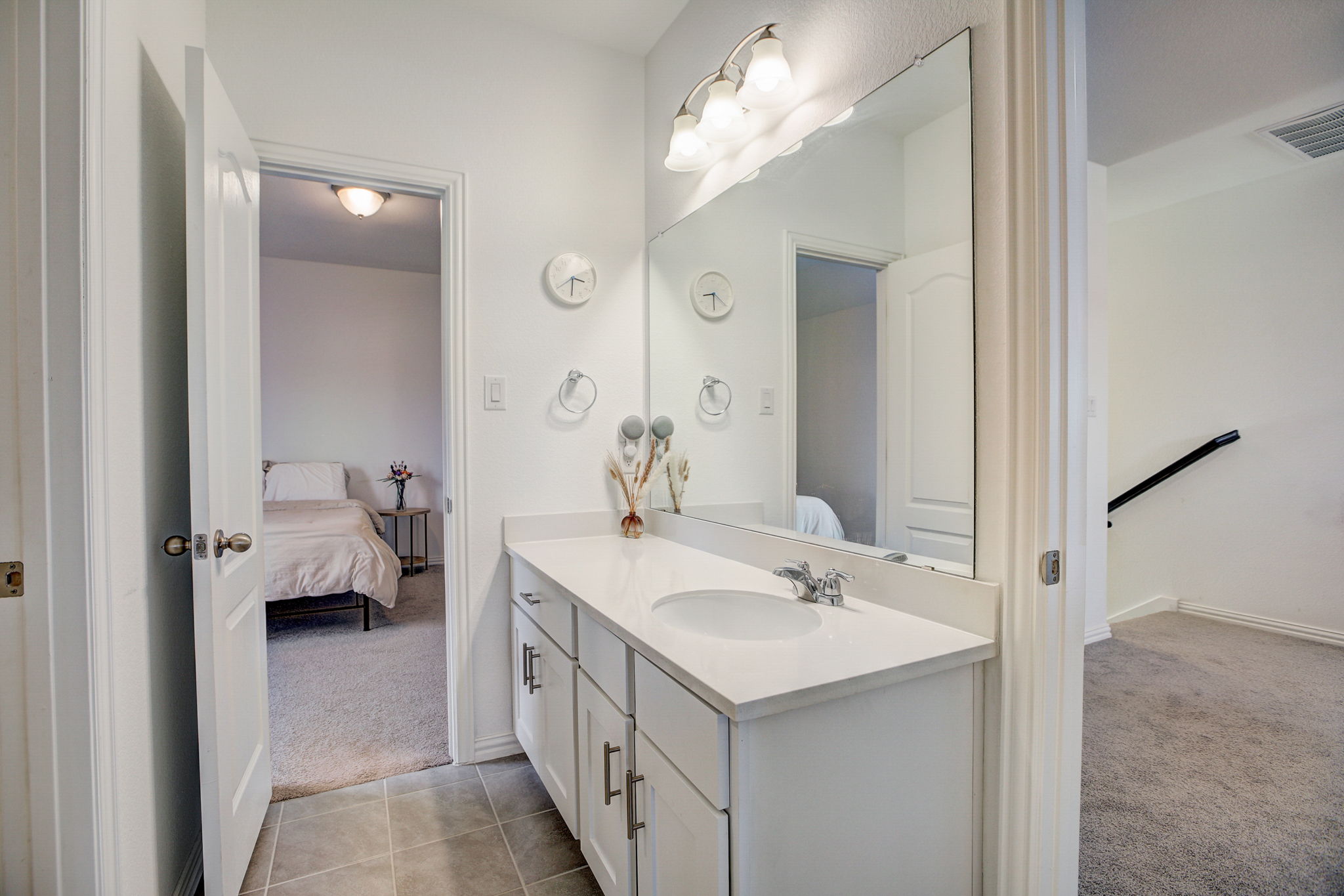 308 Monteforte Road Hutto, TX 78634 - Photo 20 of 32 a en suite bathroom with a sink double vanity and a mirror