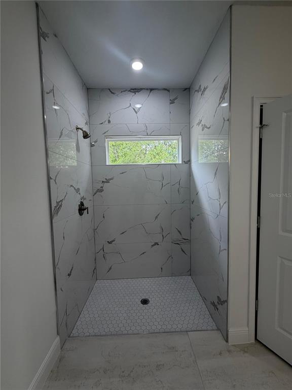 16252 Southwest 27th Terrace Road Ocala, FL 34473 - Photo 11 of 15 a bathroom with a shower