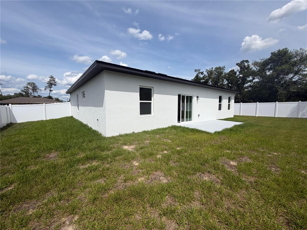 16252 Southwest 27th Terrace Road Ocala, FL 34473 - Photo 15 of 15 a house view with a garden space