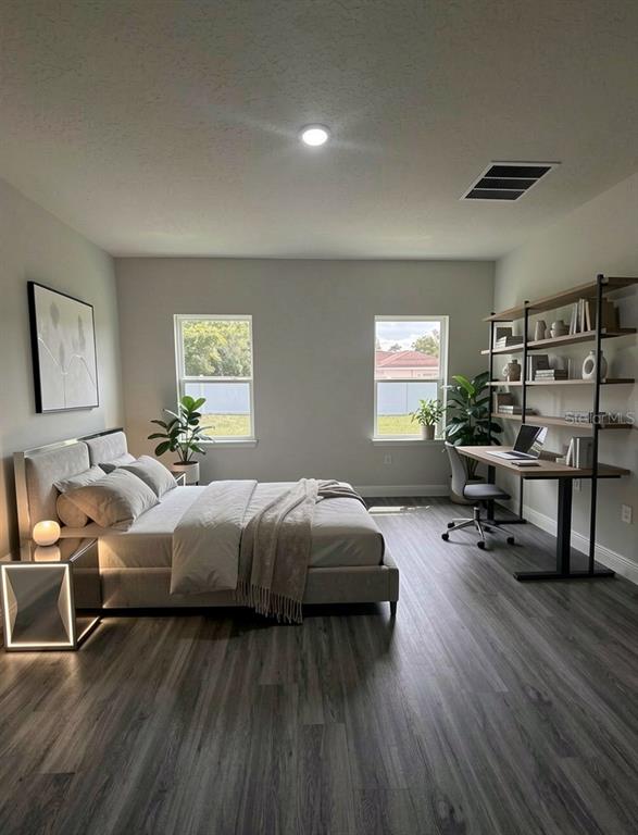 16252 Southwest 27th Terrace Road Ocala, FL 34473 - Photo 3 of 15 a bed room with bed and a window