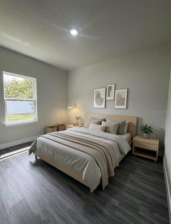 16252 Southwest 27th Terrace Road Ocala, FL 34473 - Photo 7 of 15 a bedroom with bed and window