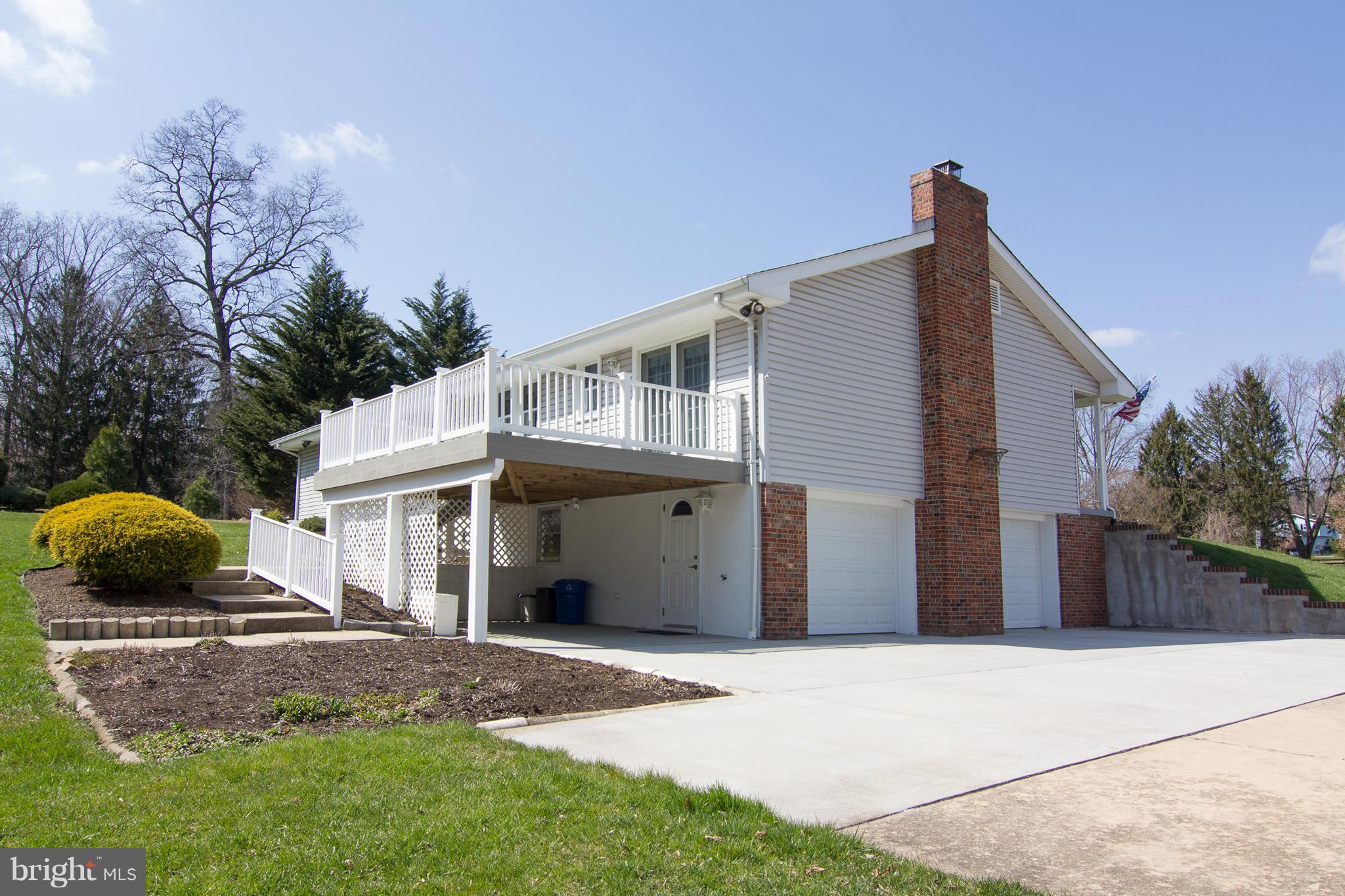 1104 Sturbridge Road Fallston, MD 21047 - Photo 2 of 28 a front view of a house with a yard and garage