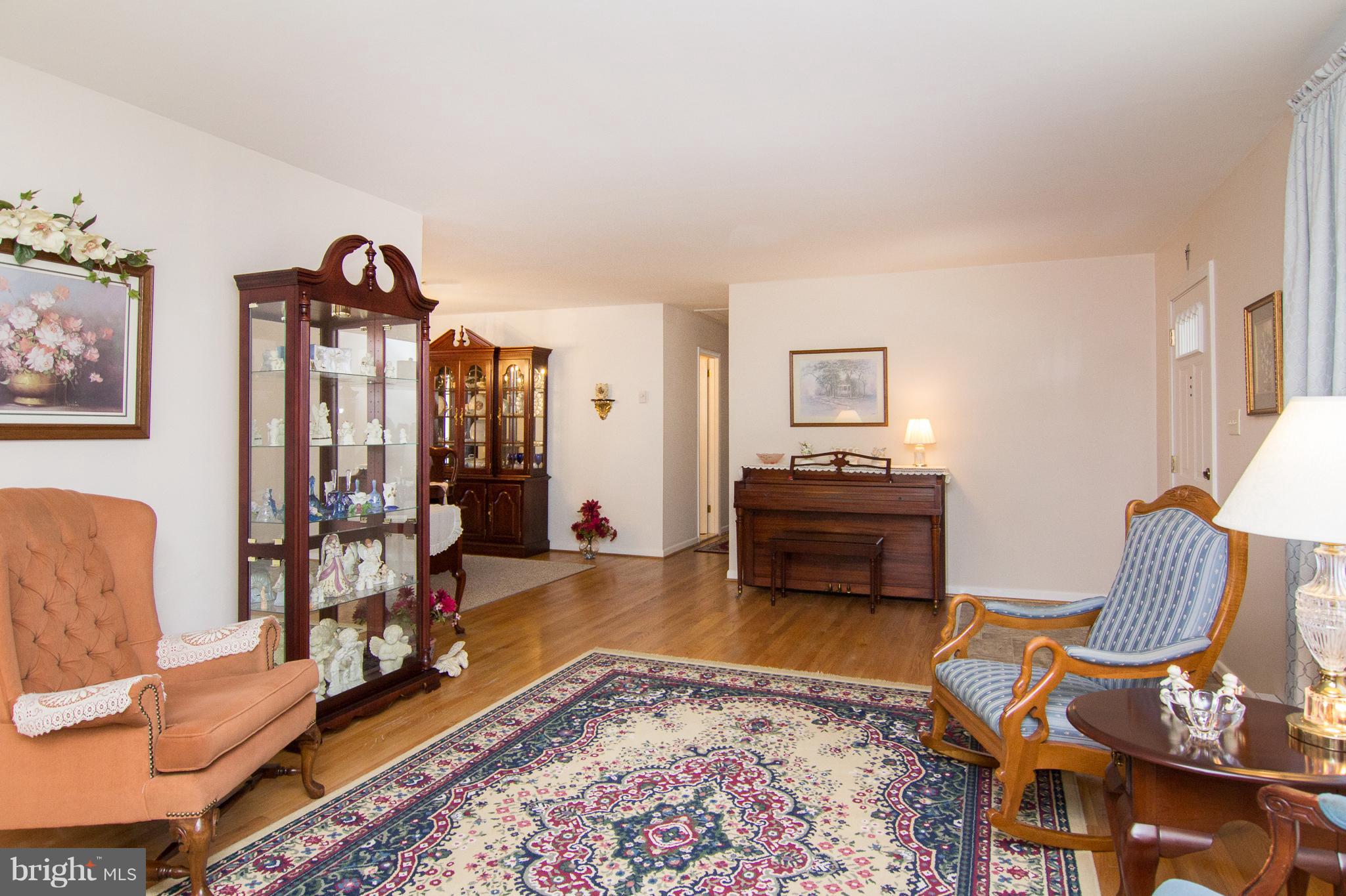 1104 Sturbridge Road Fallston, MD 21047 - Photo 12 of 28 a living room with furniture and a wooden floor