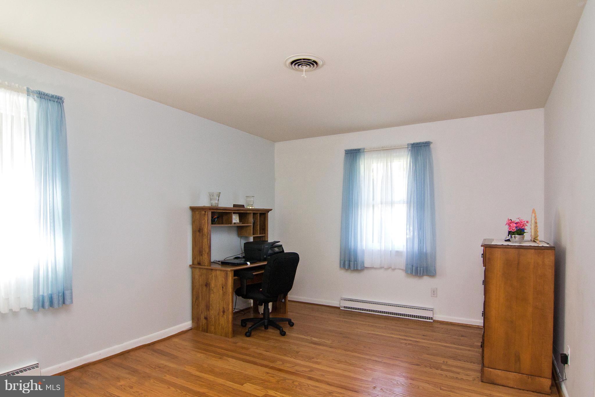 1104 Sturbridge Road Fallston, MD 21047 - Photo 16 of 28 a view of a workspace with furniture and a window