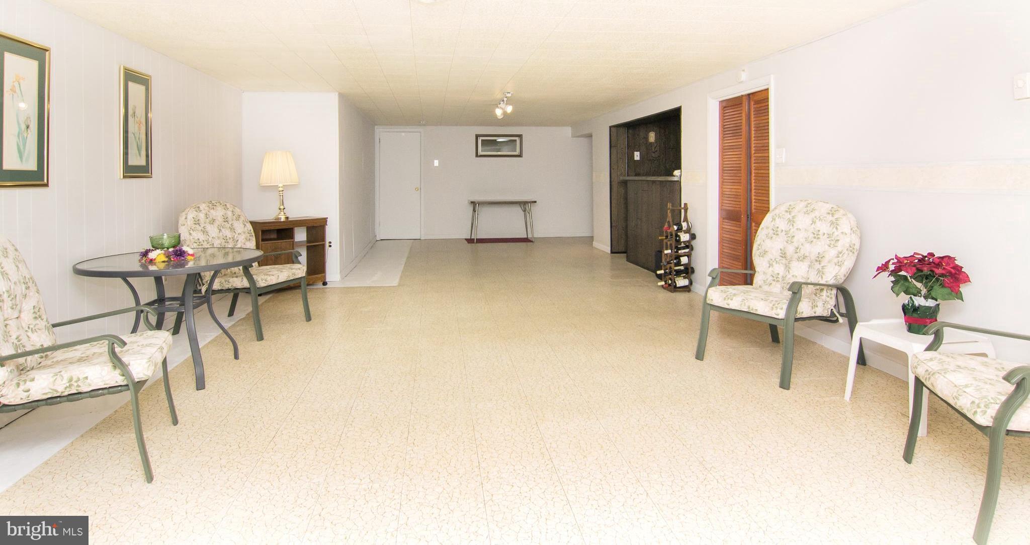 1104 Sturbridge Road Fallston, MD 21047 - Photo 19 of 28 a living room with furniture and flowers