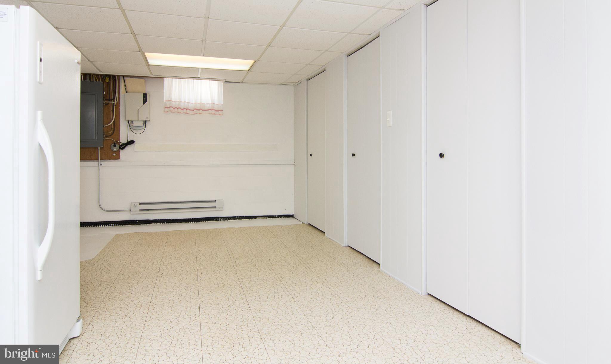 1104 Sturbridge Road Fallston, MD 21047 - Photo 21 of 28 a view of a refrigerator in kitchen and an empty room